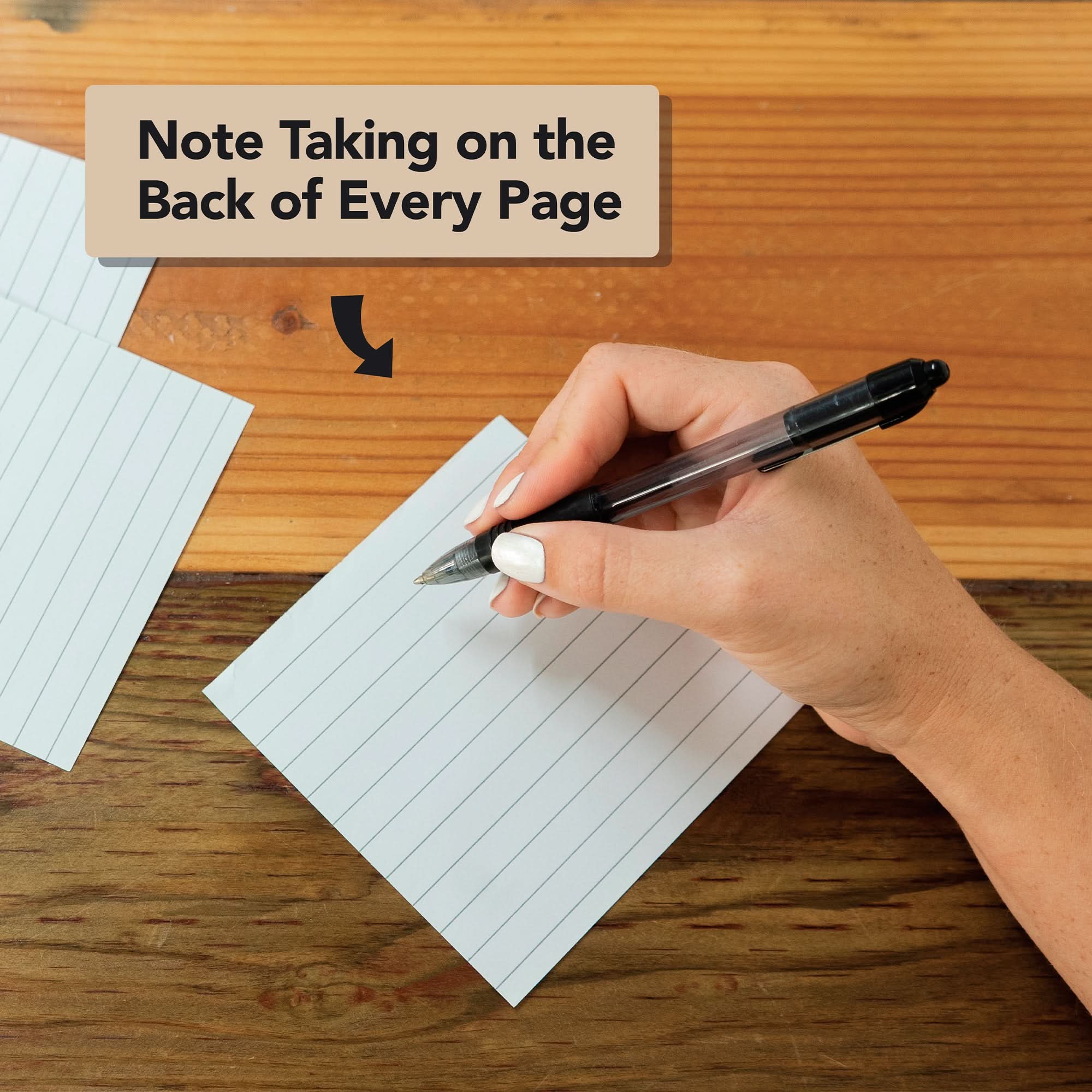 A hand writes in large print on the back of an Eterna Goods 2026 Large Text Calendar page—ideal for daily mindfulness journaling or crafting your own mindfulness calendar. "Note Taking on the Back of Every Page" appears above.