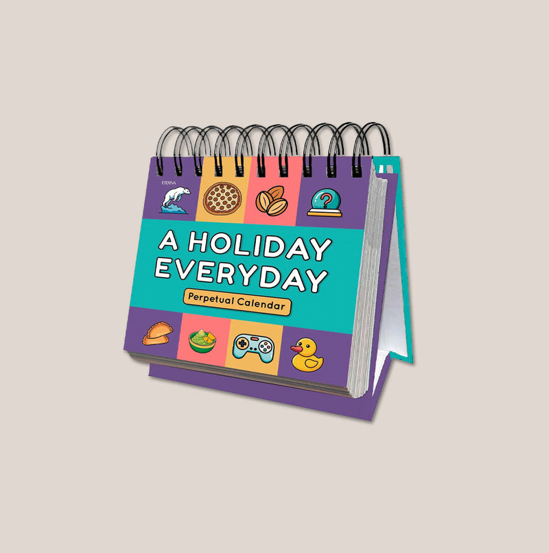 A colorful spiral-bound perpetual calendar titled "A Holiday Everyday," featuring playful icons like pizza, a clock, and a game controller on the cover.