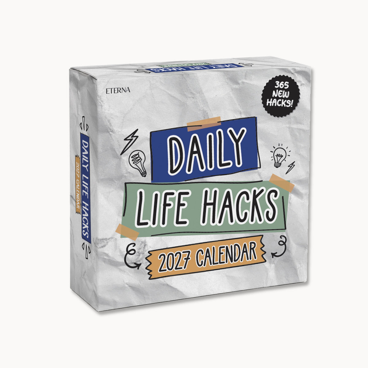 A box labeled "2026 Daily Life Hacks Calendar" by Eterna Goods, decorated with vibrant text and icons, featuring a note that reads "365 new hacks!" on a clean white background—a perfect desk calendar filled with productivity ideas to brighten your year.