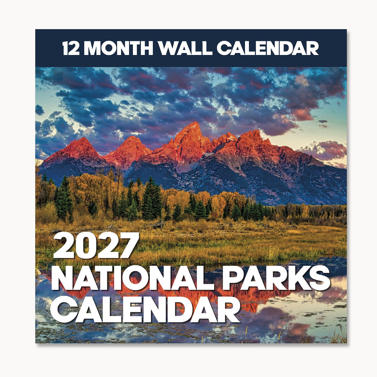 Cover of the 2027 National Parks Wall Calendar by Eterna Goods, showcasing a breathtaking mountain landscape with trees, a tranquil pond, and vivid sunset clouds—an ideal choice for outdoor lovers and fans of beautiful National Park photography.