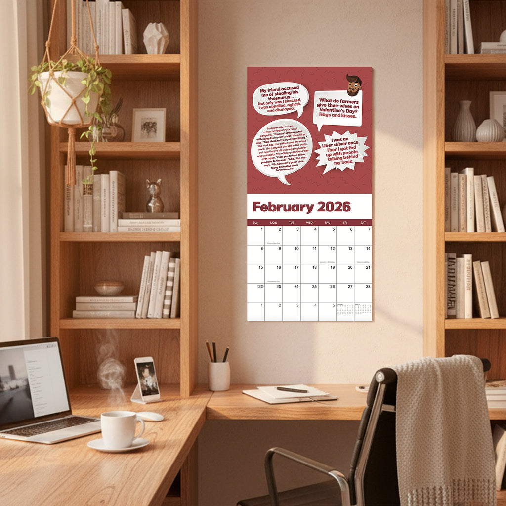 The 2026 Dad Joke Wall Calendar by That Is So Dad hangs above a desk with shelves, books, a plant, and a cup, adding humor and style to your home office as you keep track of your schedule.