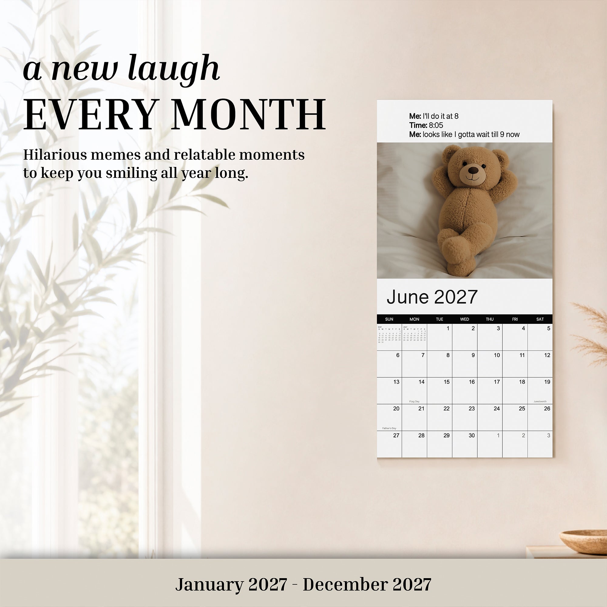 The Eterna Goods 2027 Meme Wall Calendar is open to June 2027, showcasing a cheerful teddy bear and colorful meme artwork. The tagline “a new laugh EVERY MONTH” appears above, reflecting the calendar’s promise to deliver joy and humor throughout the year.