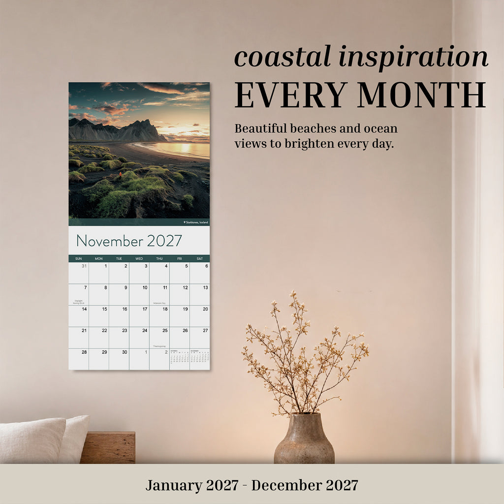 Eterna Goods 2027 Beaches Wall Calendar: This 12-month wall calendar features stunning beach photography, offering coastal inspiration every month from January to December 2027. Shown is the November 2027 page, displaying a scenic coastal landscape.