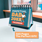 The Eterna Goods Perpetual Dad Joke Calendar sits on a desk with an easel display, featuring full-color art, spiral binding, and a label that reads "365 Pages The Perfect Gift!.