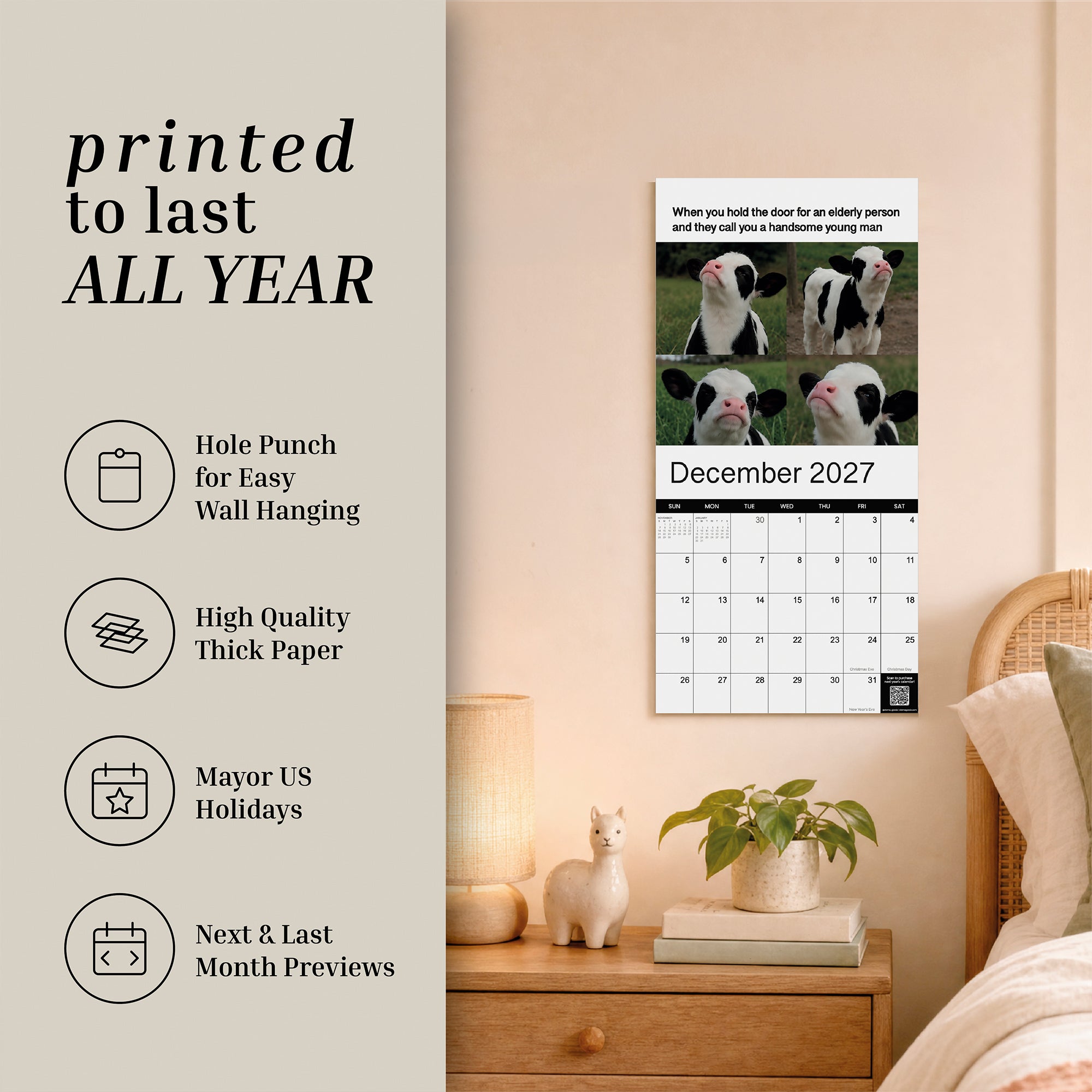 The 2027 Meme Wall Calendar by Eterna Goods is displayed for December 2027, featuring a humorous photo of four cows. It hangs on a beige wall above a lamp and a shelf with decorative items, with printed product details shown on the left.