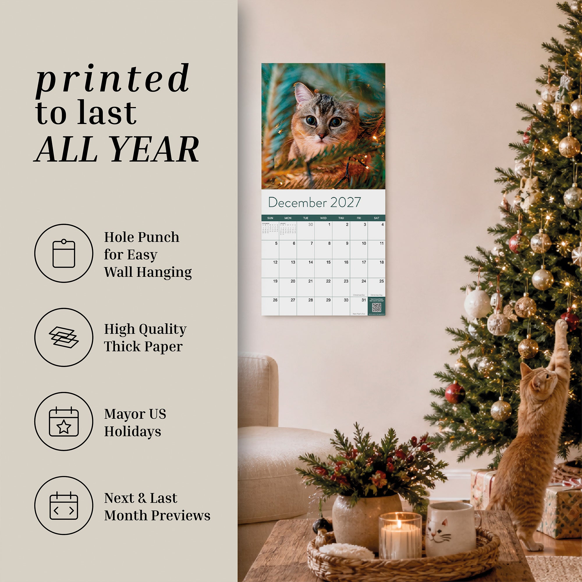 A cozy living room features a decorated Christmas tree, a curious cat reaching for ornaments, and the Eterna Goods 2027 Cats Wall Calendar displayed on the wall, featuring an adorable cat photo for December 2027. The description emphasizes the calendar’s highlights, making it an ideal choice to complete any cat lover’s Eterna Goods Cats Wall Calendar collection.