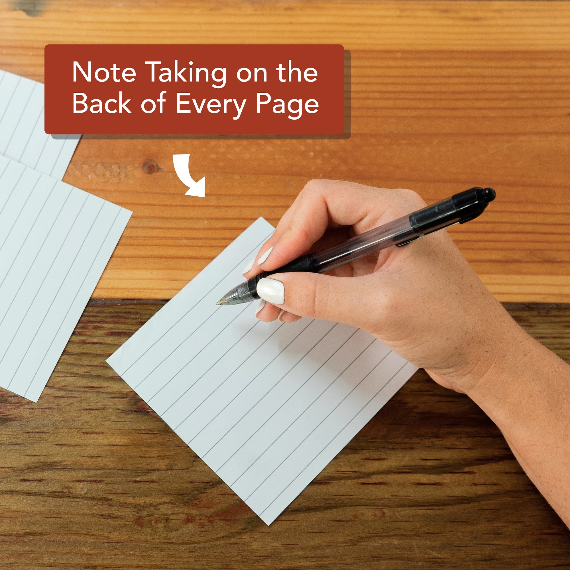 A hand holding a pen writes on a lined card with “Note Taking on the Back of Every Page” above—the Hannah Faith 2026 Verse A Day Calendar, a perfect mindfulness gift for capturing daily inspiration.