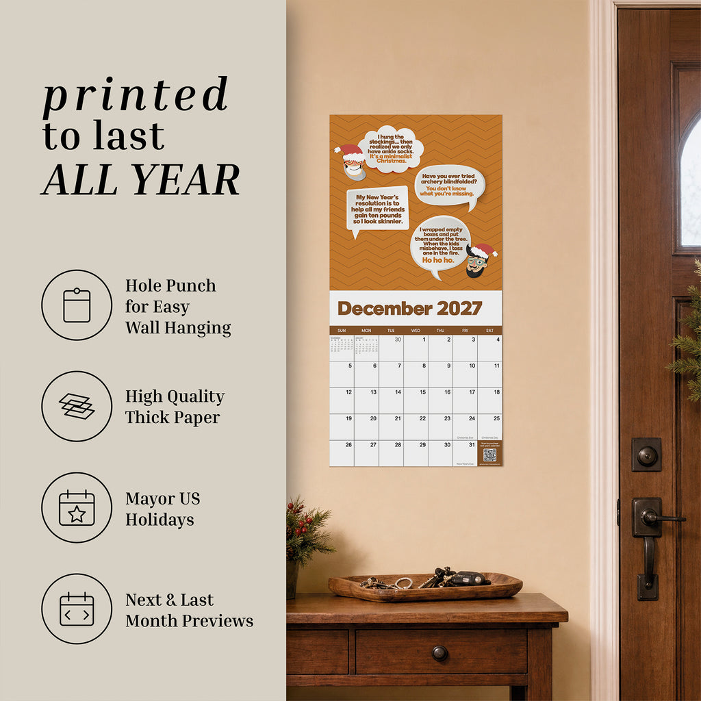 The 2027 Dad Joke Wall Calendar from That Is So Dad hangs near a door, featuring icons and text that highlight its thick paper, US holidays, wall punch for easy hanging, and month previews. Perfect for bringing humor to your daily routine, this calendar combines functionality with fun.