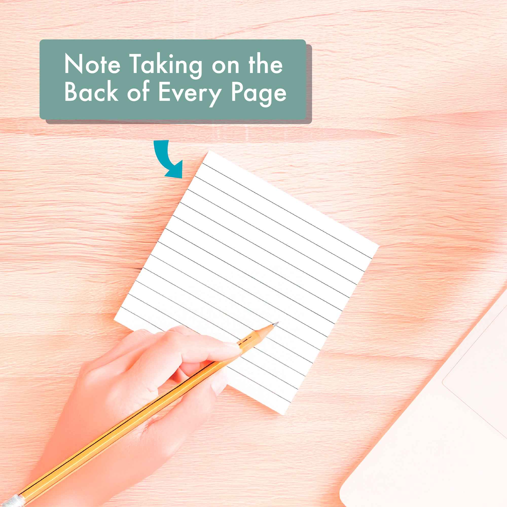 A hand writes on a notepad next to a laptop, featuring the Eterna Goods 2025 Mindfulness Calendar—ideal for daily mindfulness practices and stress reduction. The calendar offers "Note Taking on the Back of Every Page.