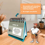 The Eterna Goods Perpetual Dad Joke Calendar shows a dad joke for April 13, with nearby text noting its recyclable, plastic-free easel. A smiling illustrated janitor stands by the calendar’s full-color art.