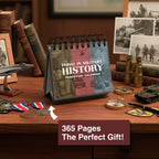 The Eterna Goods "Today In Military History Perpetual Calendar" sits on a wooden desk with medals, coins, and books; the label says "365 Pages The Perfect History Gift!"—an ideal pick for military history fans who love daily facts.