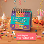 The A Holiday Everyday Perpetual Calendar by Eterna Goods adds color to a table decorated with confetti, snacks, and Halloween items for a fun daily celebration.