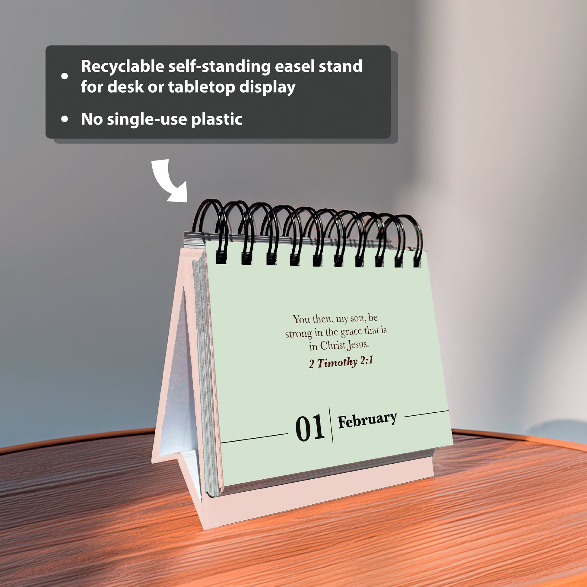 The Hannah Faith Verse A Day Perpetual Calendar stands spiral-bound on a wooden surface, showing February 1. Text above highlights it is recyclable, self-standing, and free from single-use plastic.