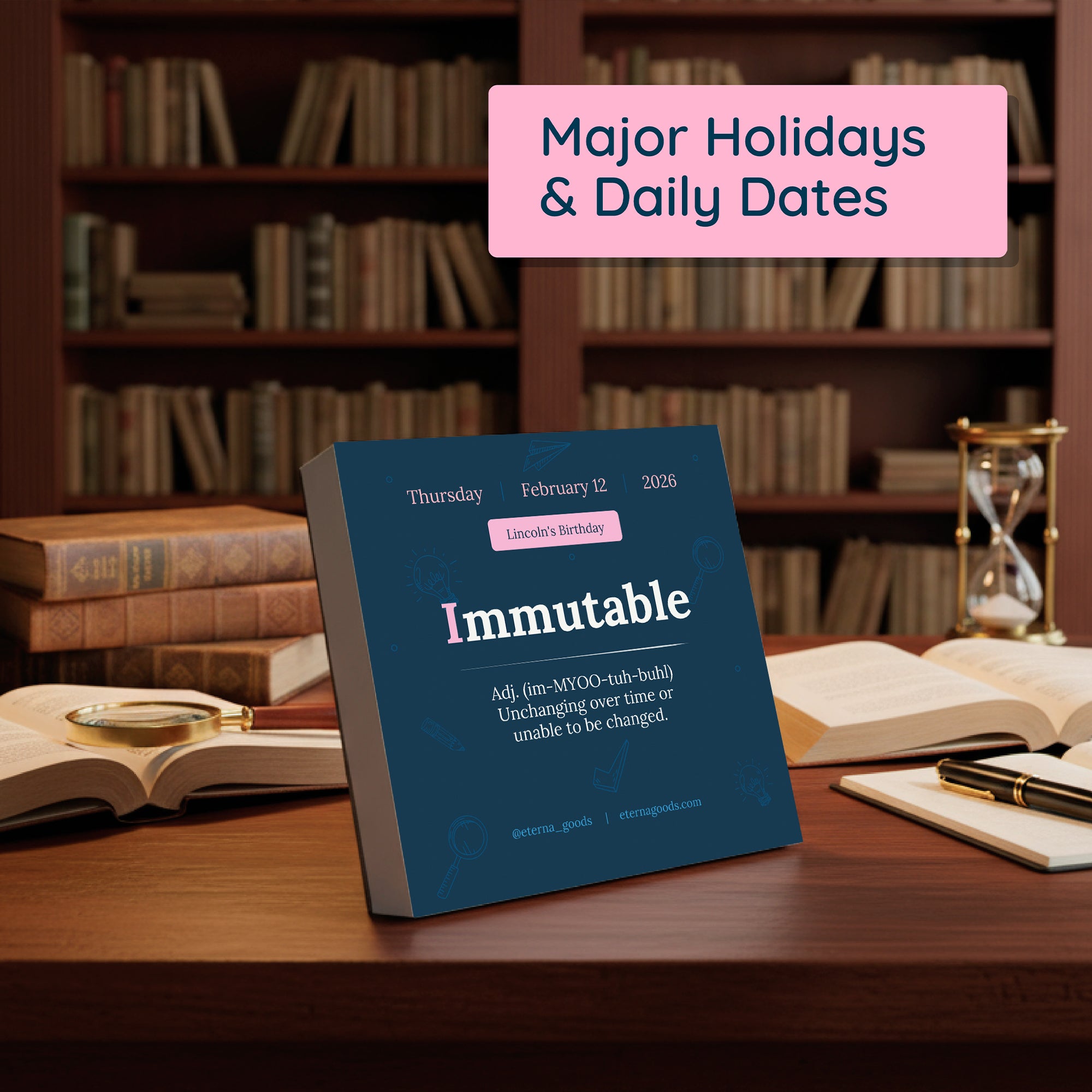 The 2026 Word Of The Day Calendar by Eterna Goods displays "Immutable" for February 12—Lincoln's Birthday—serving as a vocabulary builder on a library desk with bookshelves in the background.
