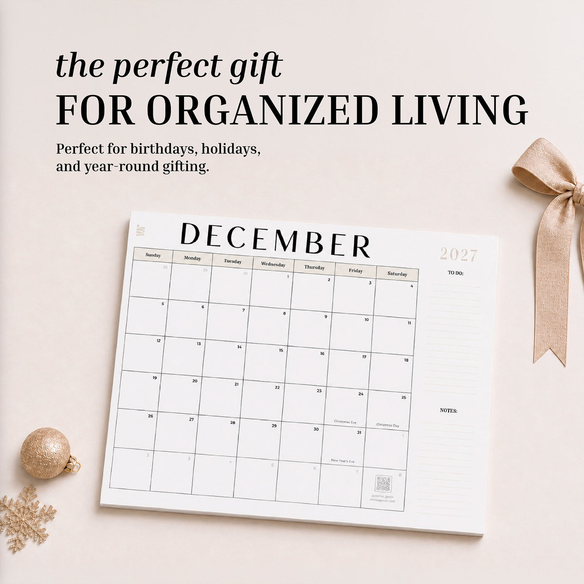 2027 flat desk calendar December page styled as a gift with a ribbon