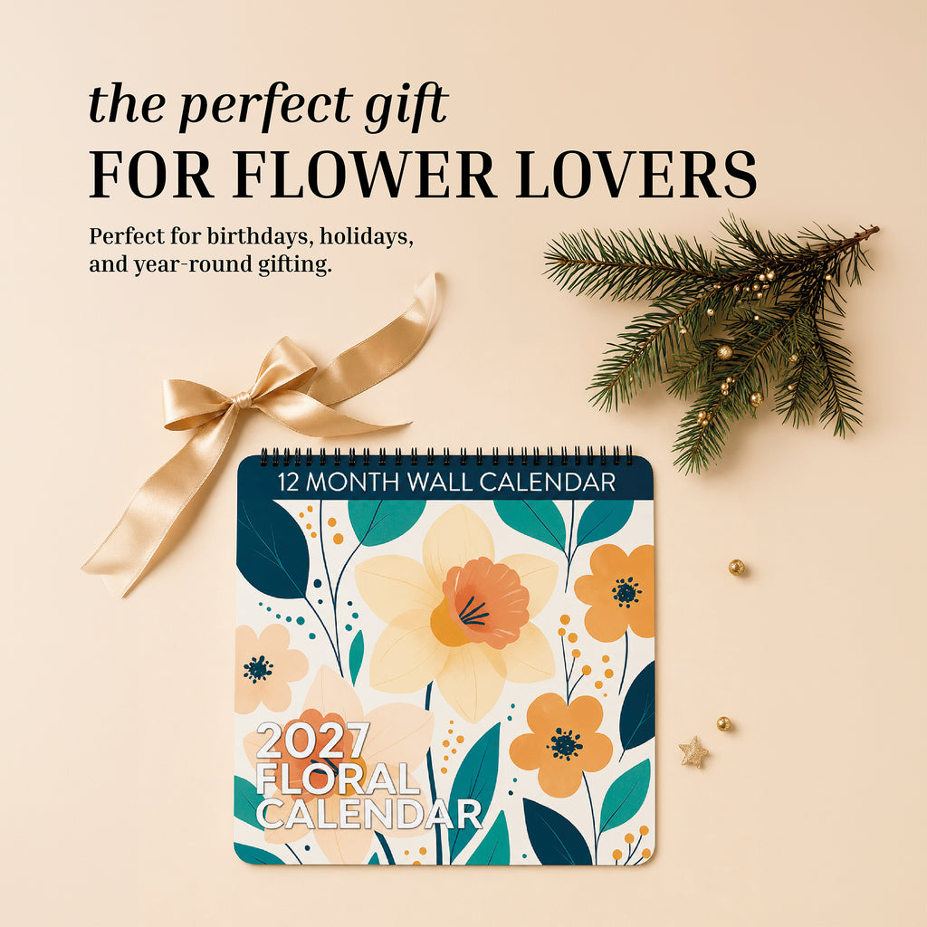 The 2027 Floral Wall Calendar by Eterna Goods features yellow flowers, a ribbon, pine branch, and gold star decorations on a beige background. Showcasing stunning flower photography and an elegant design, this calendar is the perfect gift for flower lovers.