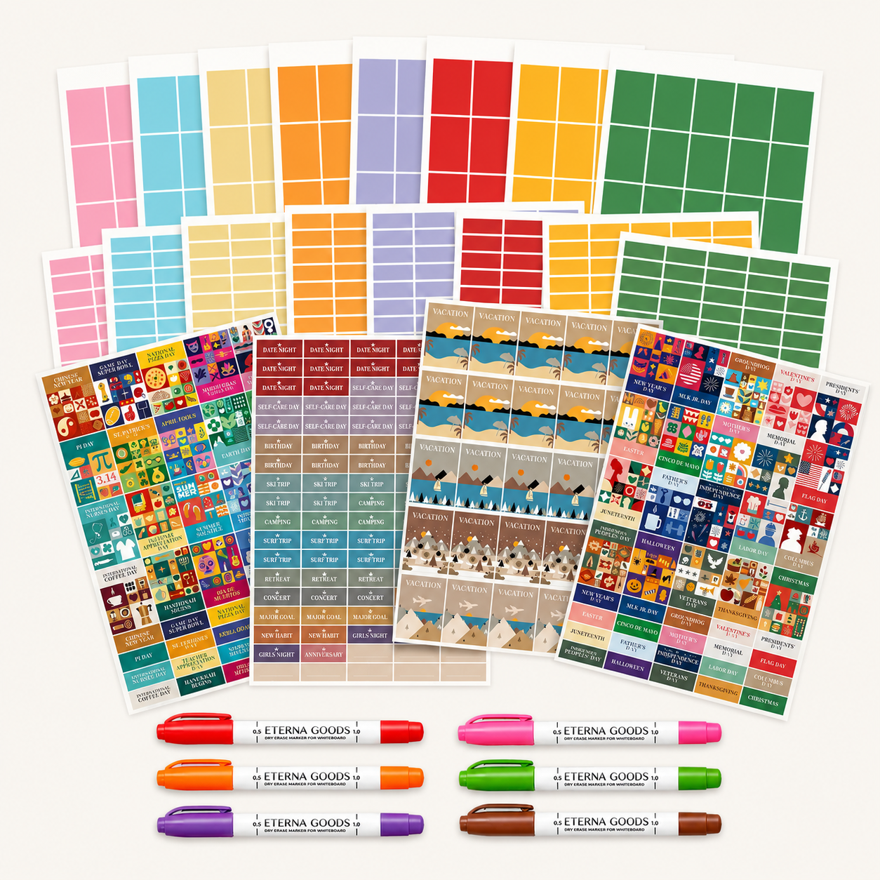Assorted sheets of colorful planning stickers with book and reading themes, plus five dry erase markers with “Eterna Goods” printed labels, all arranged neatly on a light background—perfect for your wall calendar planning kit.