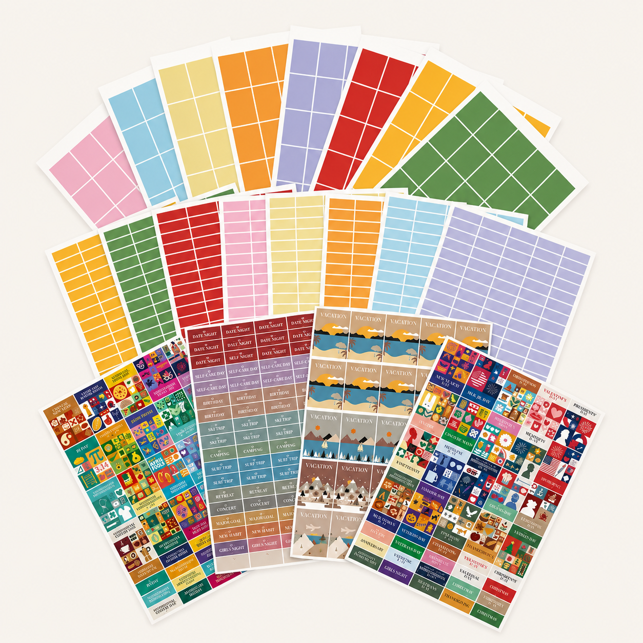 A variety of rectangular and square stickers in vibrant solid colors and fun illustrated designs from the Eterna Goods Planning Sticker Kit are spread out on a white surface, making this set ideal for adding color and organization to your calendars or planners.