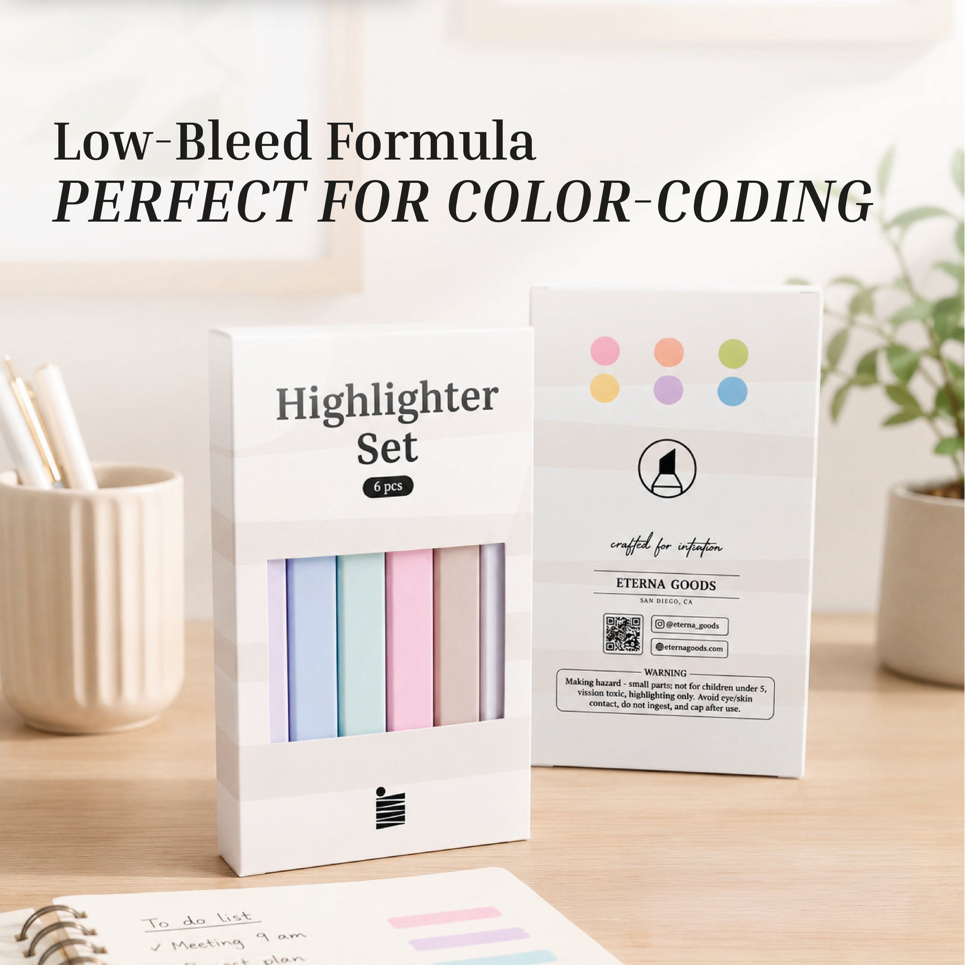 A six-piece Eterna Goods Highlighter Set in white packaging is displayed on a desk with notes, pen holders, and plants. The text above says "Low-Bleed Formula PERFECT FOR COLOR-CODING." Enjoy smooth color from these chisel tip highlighters.