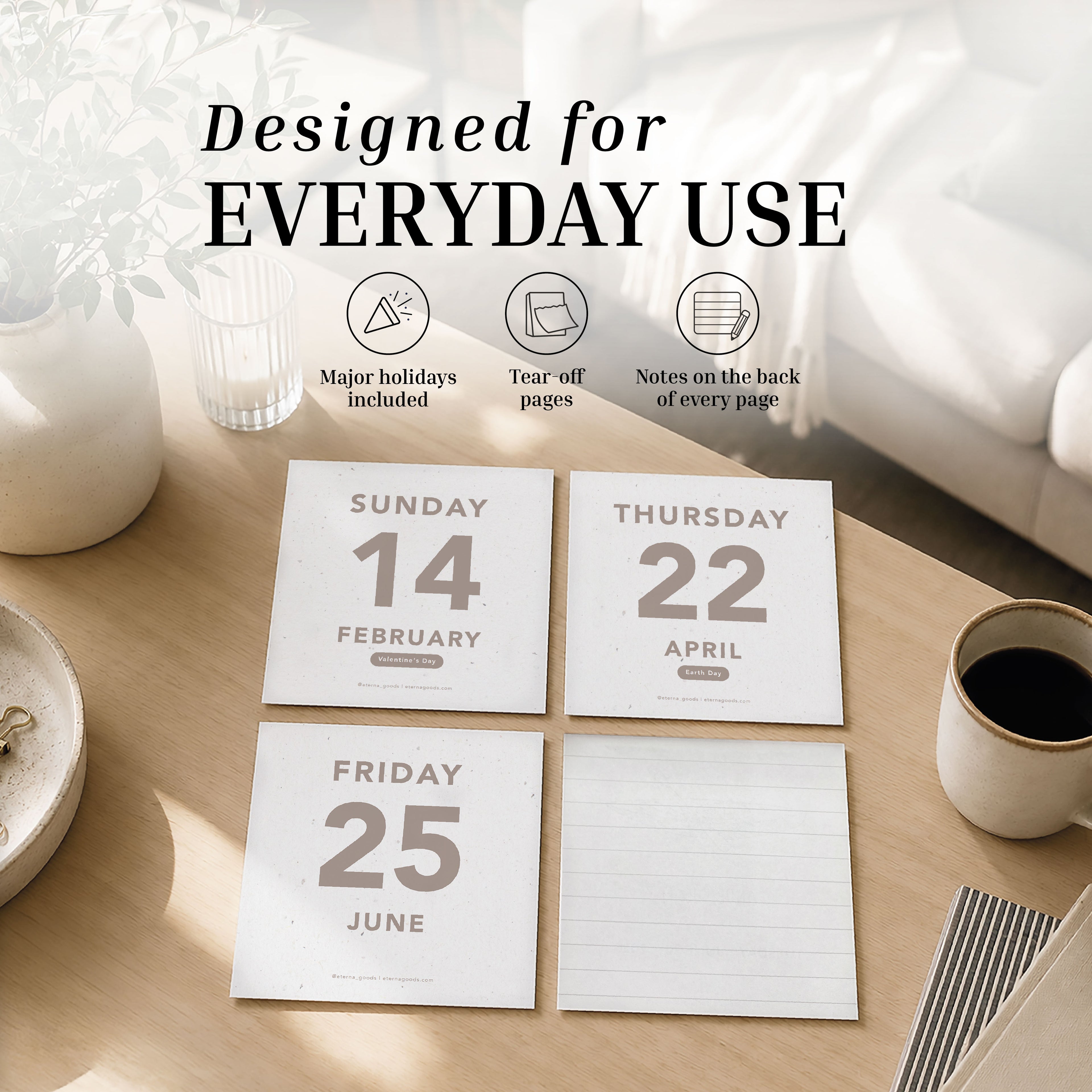 Four tear-off calendar pages for February 14, April 22, and June 25 from the Eterna Goods 2027 Large Text Calendar are displayed on a table near a coffee cup, a glass of water, and a plant, highlighting the everyday functionality and easy-to-read dates of this daily tear-off desk calendar.