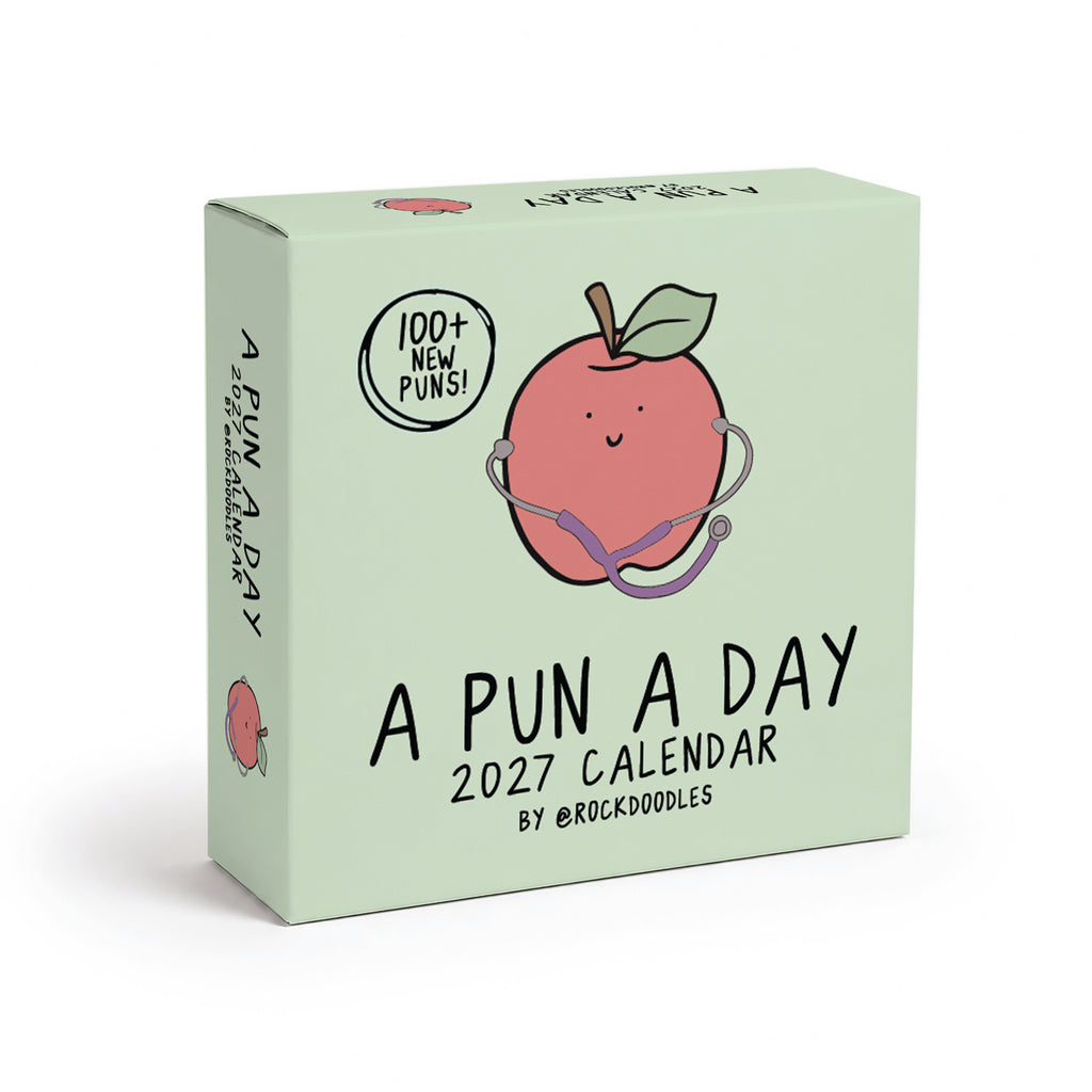 Box for the "2026 A Pun a Day Calendar" by rockdoodles, featuring a cheerful apple with a stethoscope illustration and text showcasing over 100 new puns. This family-friendly daily joke calendar is perfect for anyone who loves to laugh every day!.