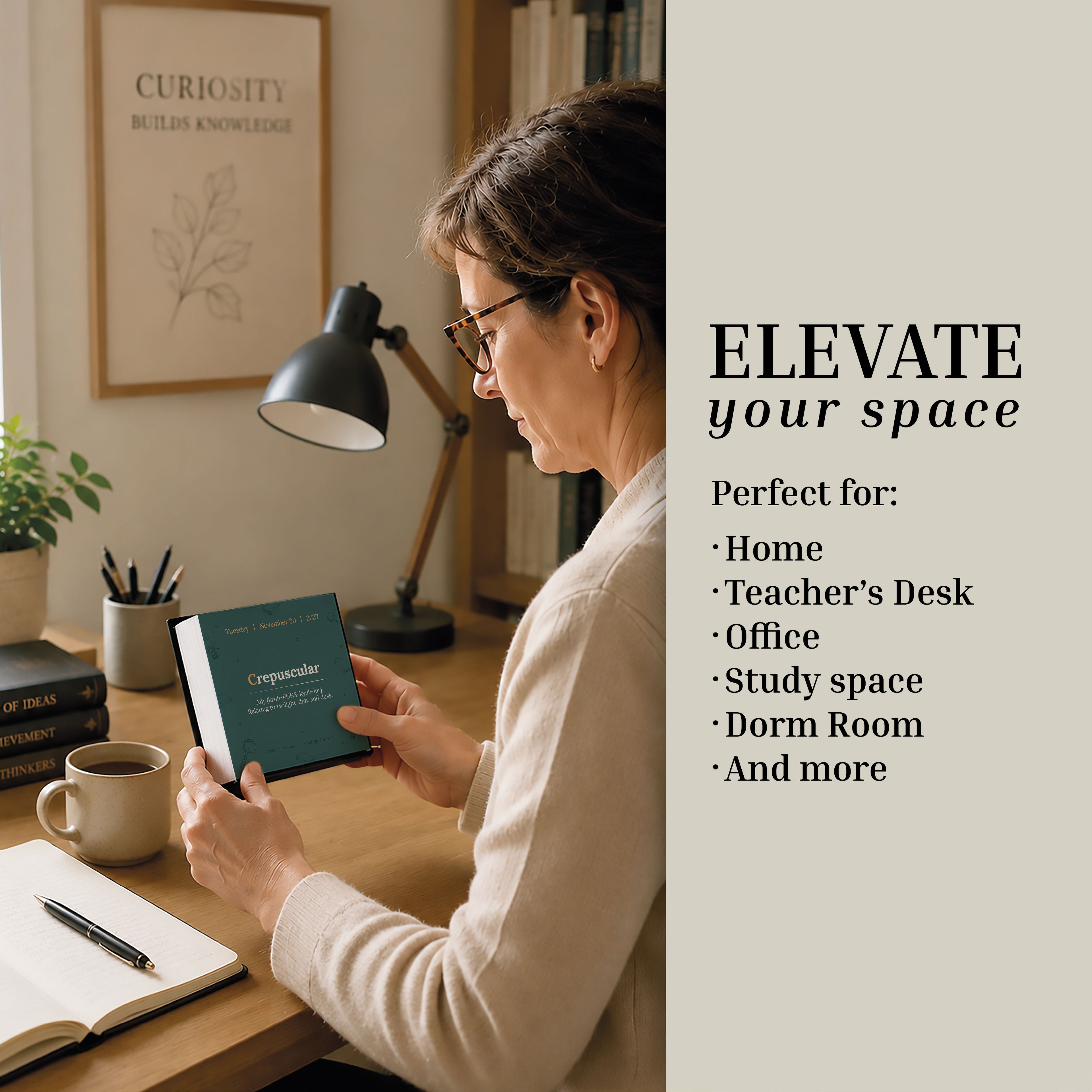A woman sits at a desk, holding an inspiring framed quote, surrounded by books, a lamp, and a plant; let the featured message encourage you to elevate your home, office, or study space—brighten each area with thoughtful additions like the Eterna Goods 2027 Word Of The Day Calendar for daily vocabulary inspiration.