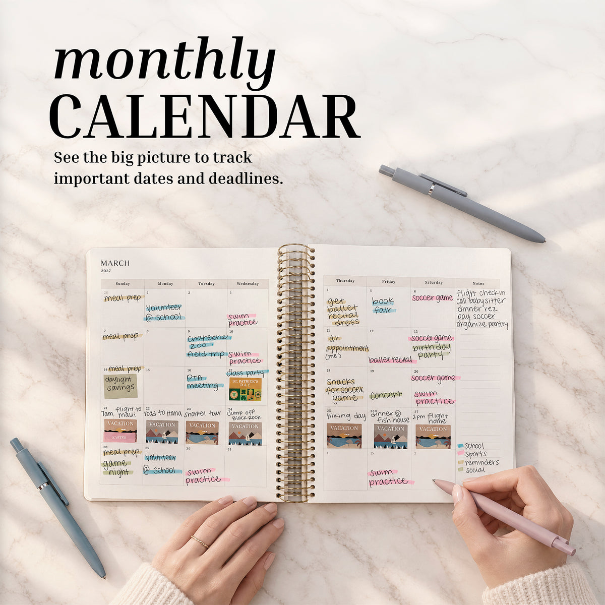 Dated Weekly Planner 2027 monthly calendar spread being written in on a marble desk
