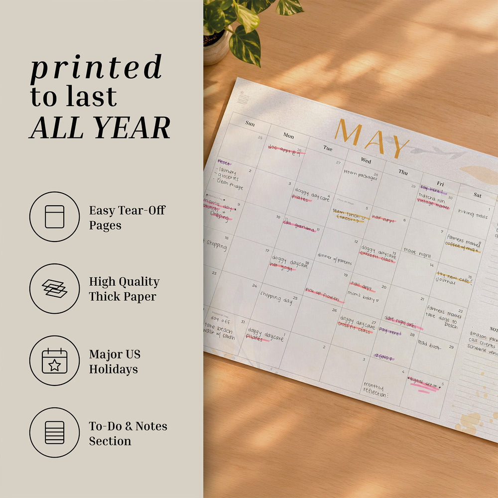 2027 Floral flat desk calendar May page with feature icons: tear-off pages, thick paper, US holidays, notes