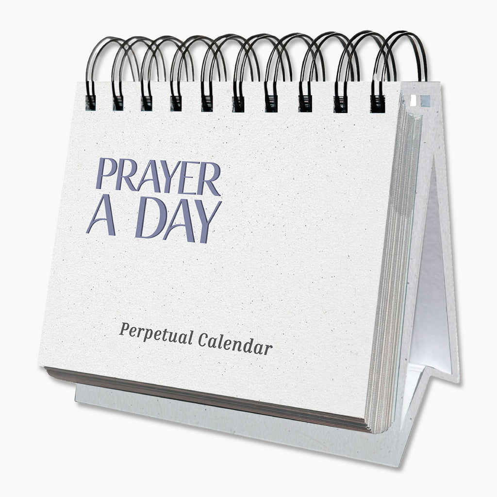 The Eterna Goods Perpetual Prayer A Day Calendar is a white, spiral-bound calendar designed to stand upright, featuring inspirational prayers for each day of the year.