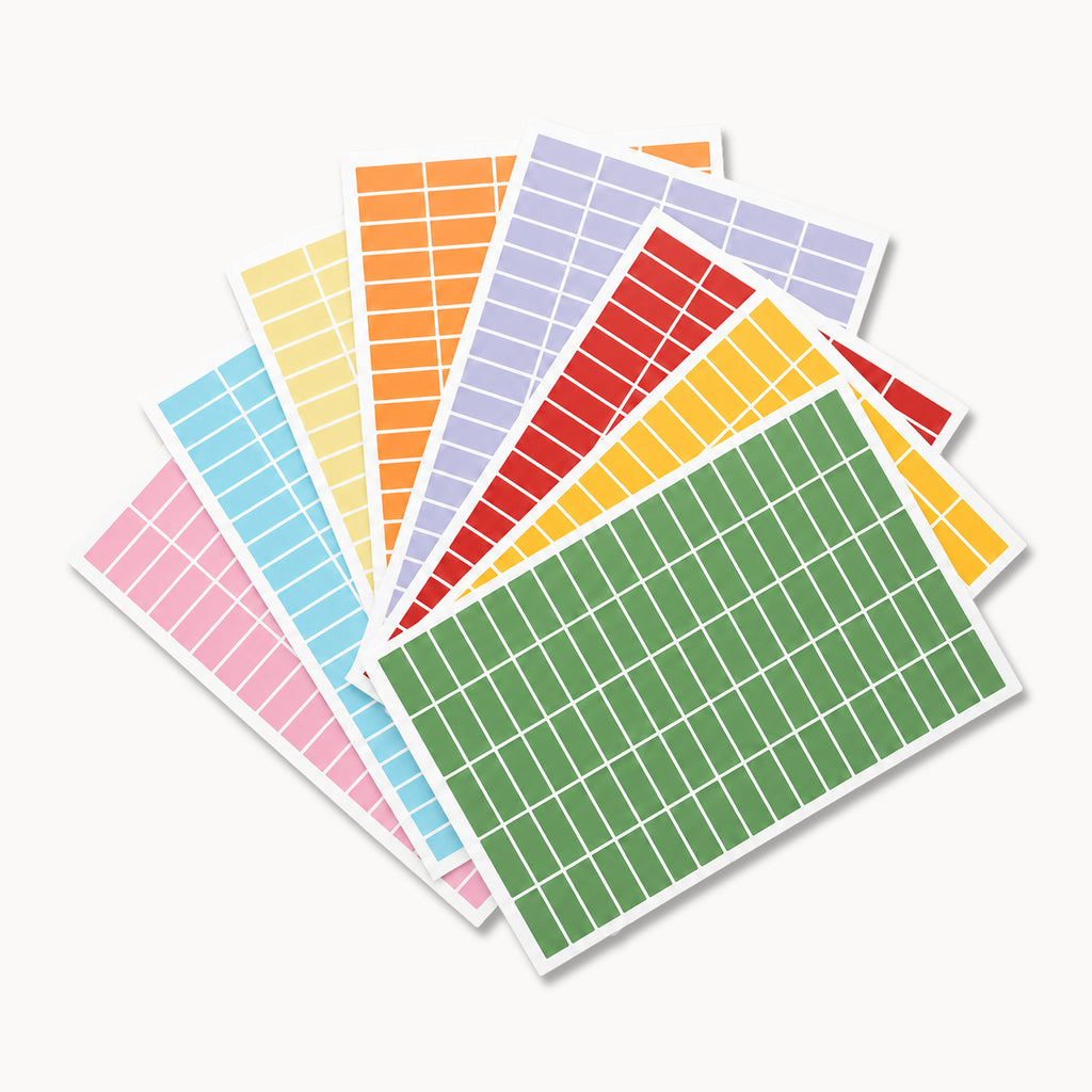 Eterna Goods Planning Block Stickers: a fan-shaped set of colorful sheets, each with a grid of rectangular calendar stickers—perfect for organizing your schedule.