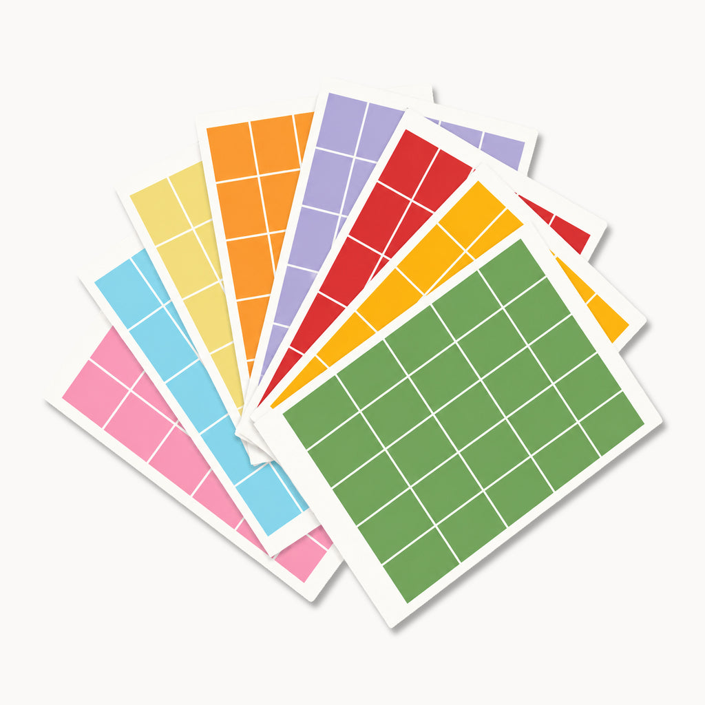 Eight sheets of Eterna Goods Planning Block Stickers are fanned out, each in a distinct color and divided into a grid of equal-sized rectangles—making them ideal for efficient organization as planning stickers or wall calendar stickers.