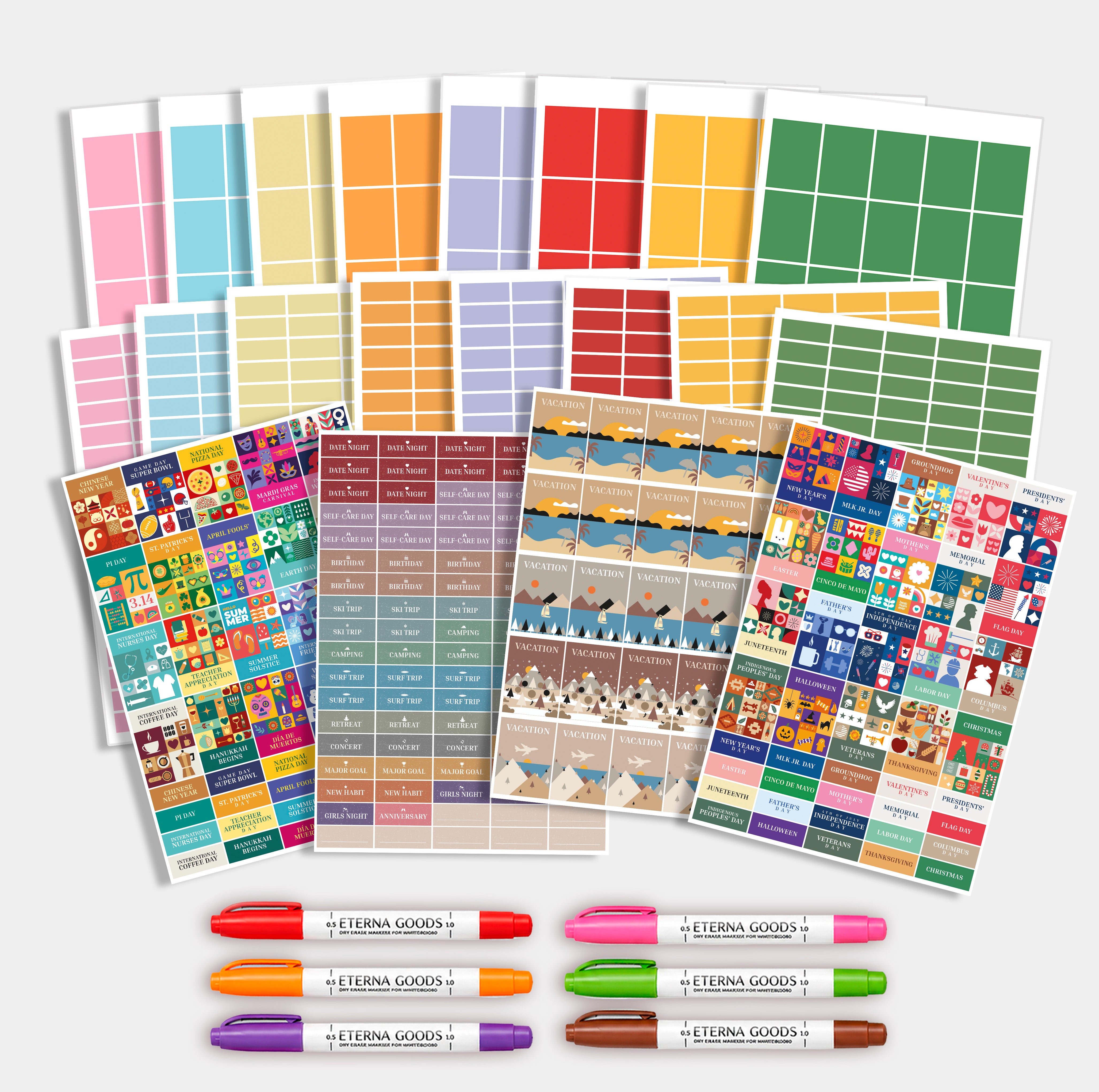 The Ultimate Own The Year Bundle by Eterna Goods includes assorted colorful planning sticker sheets and five dry erase markers—ideal for organizing your space.